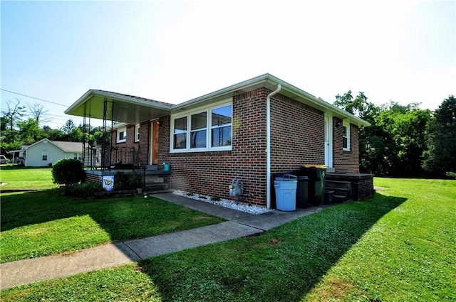 111 Wood St, Rostraver, PA 15089 - view of front of home with brick siding and a front lawn