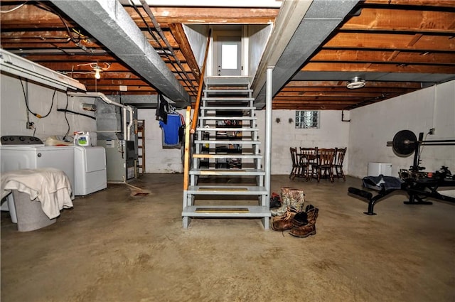 111 Wood St, Rostraver, PA 15089 - below grade area featuring stairway, separate washer and dryer, and heating unit