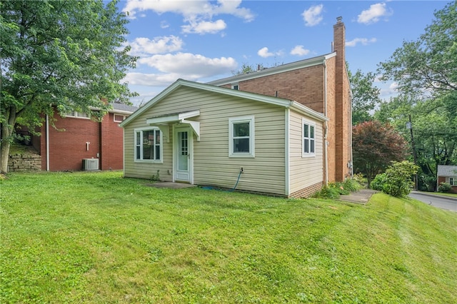 404 Atlantic Ave, Forest Hills Boro, PA 15221 - rear view of property with a chimney and a yard