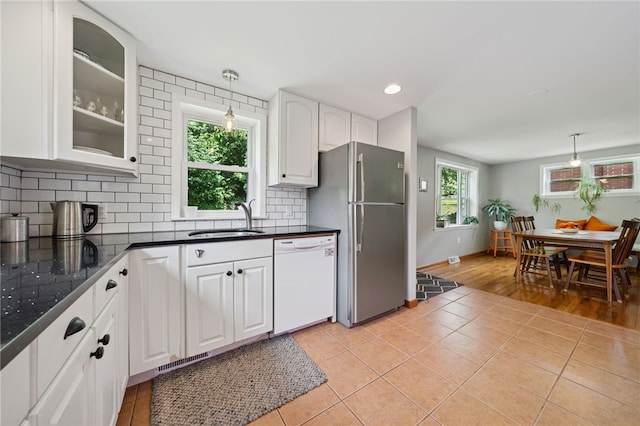 404 Atlantic Ave, Forest Hills Boro, PA 15221 - kitchen with white dishwasher, freestanding refrigerator, white cabinets, dark countertops, and light tile patterned floors