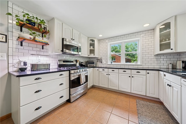 404 Atlantic Ave, Forest Hills Boro, PA 15221 - kitchen with stainless steel appliances, dark countertops, decorative backsplash, open shelves, and recessed lighting