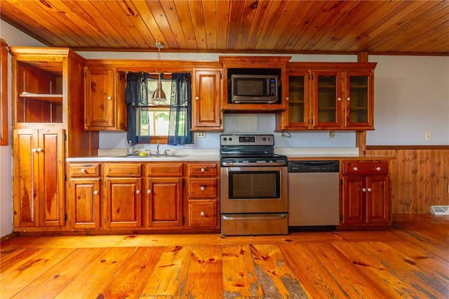 109 New Orchard Dr, Frazer, PA 15084 - kitchen with stainless steel appliances, wooden ceiling, light countertops, wainscoting, and wood walls