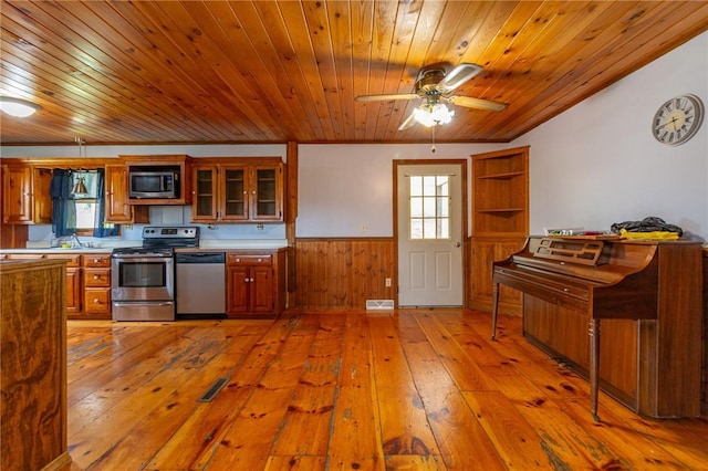 109 New Orchard Dr, Frazer, PA 15084 - kitchen featuring stainless steel appliances, wood ceiling, wainscoting, light wood-type flooring, and brown cabinets