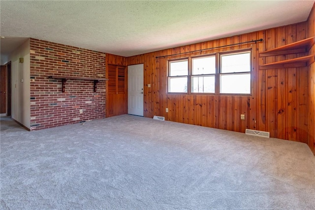 109 New Orchard Dr, Frazer, PA 15084 - unfurnished living room with carpet, a textured ceiling, and wooden walls