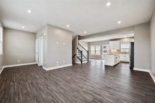 1008 Adair Ave, Middlesex Twp, PA 16059 - unfurnished living room featuring stairs, recessed lighting, and dark wood-style flooring