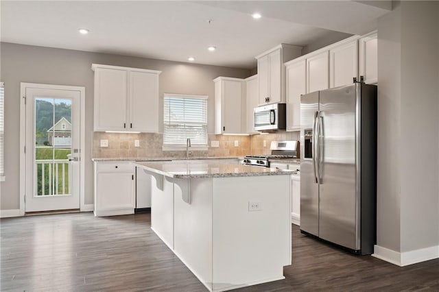 1008 Adair Ave, Middlesex Twp, PA 16059 - kitchen with stainless steel appliances, a kitchen island, white cabinets, backsplash, and recessed lighting