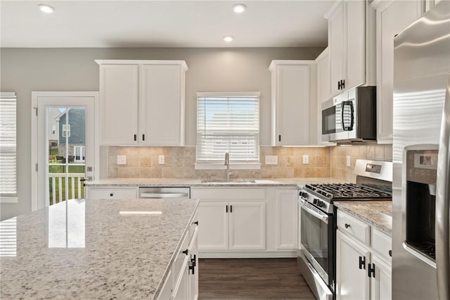 1008 Adair Ave, Middlesex Twp, PA 16059 - kitchen featuring appliances with stainless steel finishes, white cabinets, recessed lighting, dark wood finished floors, and tasteful backsplash