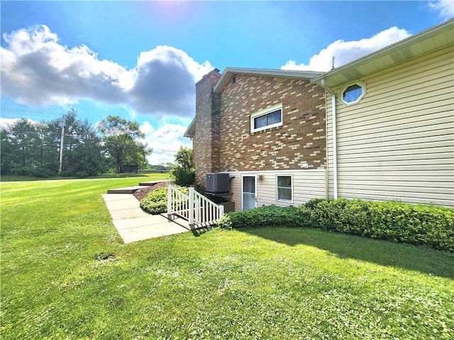 1031 Gameland Rd, Donegal, PA 16025 - view of side of property with a lawn, brick siding, and a chimney