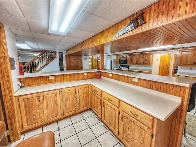 1031 Gameland Rd, Donegal, PA 16025 - kitchen with black microwave, light countertops, and light tile patterned floors