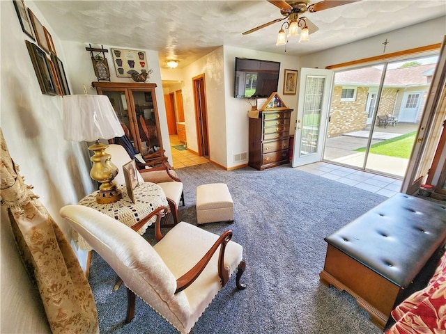 1031 Gameland Rd, Donegal, PA 16025 - carpeted living room with ceiling fan and tile patterned flooring