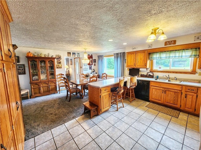 1031 Gameland Rd, Donegal, PA 16025 - kitchen with dishwasher, a peninsula, light countertops, a textured ceiling, and light tile patterned floors