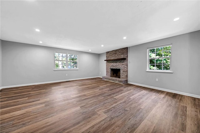 613 Newton Sq, Moon/Crescent Twp, PA 15108 - unfurnished living room with plenty of natural light, dark wood finished floors, a fireplace, and recessed lighting