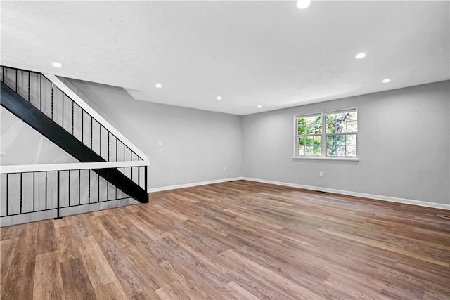 613 Newton Sq, Moon/Crescent Twp, PA 15108 - unfurnished living room with wood finished floors, recessed lighting, and stairs