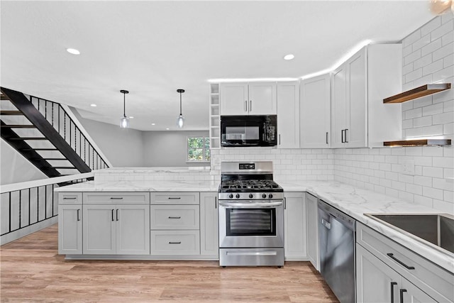 613 Newton Sq, Moon/Crescent Twp, PA 15108 - kitchen with open shelves, appliances with stainless steel finishes, a peninsula, backsplash, and recessed lighting