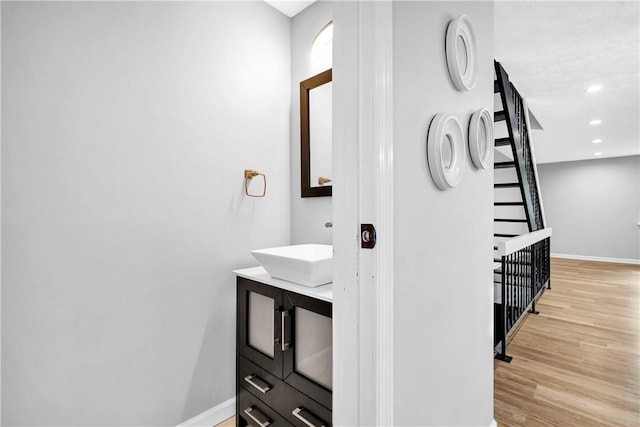 613 Newton Sq, Moon/Crescent Twp, PA 15108 - bathroom with vanity, wood finished floors, and recessed lighting