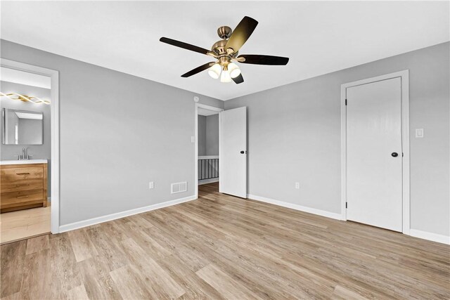 613 Newton Sq, Moon/Crescent Twp, PA 15108 - unfurnished bedroom with light wood-style flooring, ensuite bathroom, and a ceiling fan