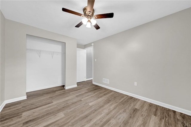 613 Newton Sq, Moon/Crescent Twp, PA 15108 - unfurnished bedroom featuring wood finished floors, a closet, and ceiling fan