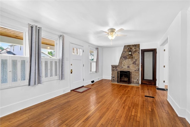 222 S 8th St, West Newton, PA 15089 - unfurnished living room featuring wood-type flooring, a fireplace, and ceiling fan
