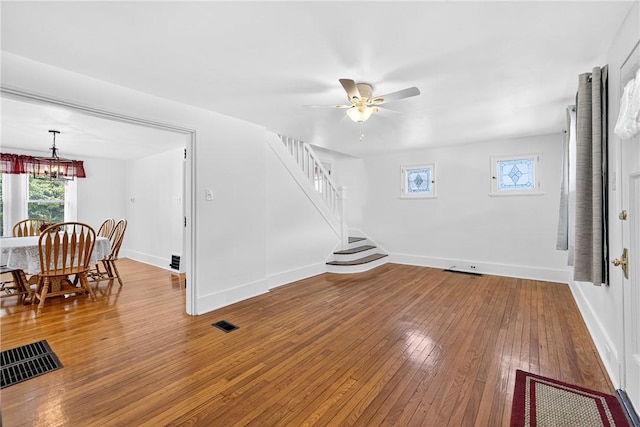 222 S 8th St, West Newton, PA 15089 - living room with a chandelier, a ceiling fan, hardwood / wood-style floors, and stairway