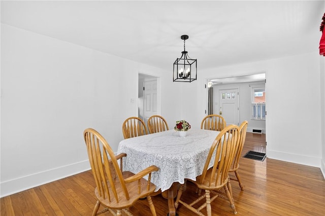 222 S 8th St, West Newton, PA 15089 - dining area with a chandelier and light wood finished floors