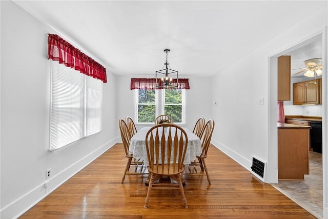 222 S 8th St, West Newton, PA 15089 - dining space featuring light wood-style floors and a chandelier