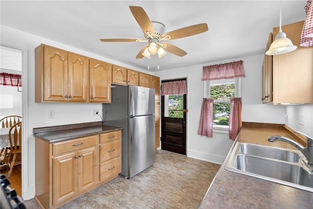 222 S 8th St, West Newton, PA 15089 - kitchen featuring freestanding refrigerator, ceiling fan, pendant lighting, dark countertops, and a desk