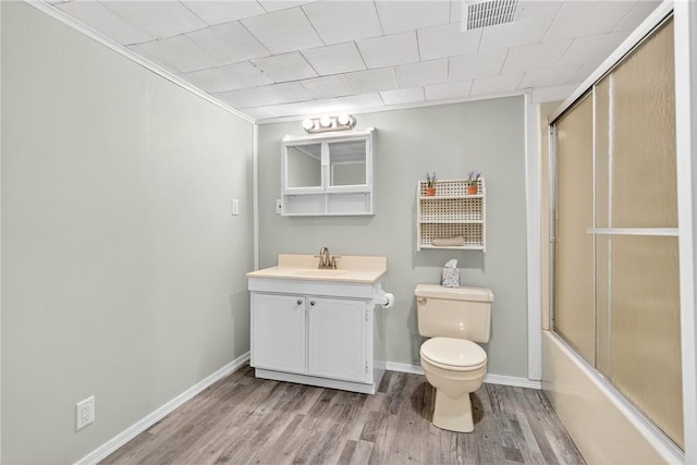 222 S 8th St, West Newton, PA 15089 - bathroom featuring wood finished floors, vanity, bath / shower combo with glass door, and ornamental molding