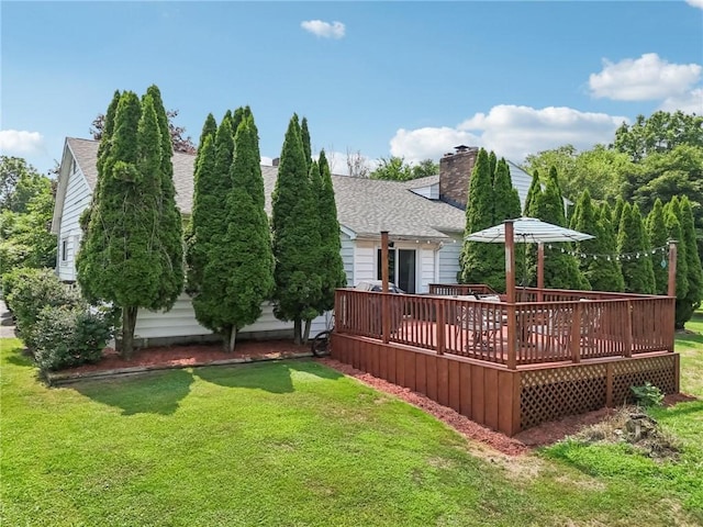 168 Debernardo Ln, Mahoning Twp, PA 16132 - back of house featuring roof with shingles, a deck, and a yard
