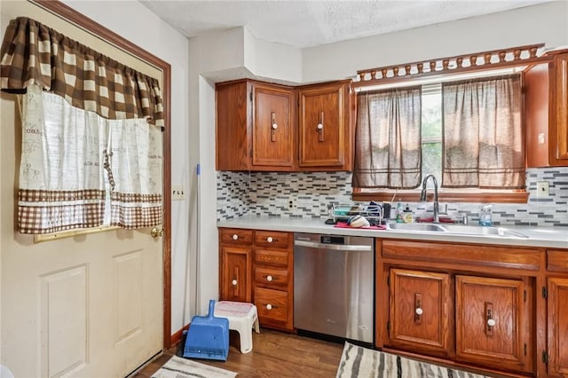 168 Debernardo Ln, Mahoning Twp, PA 16132 - kitchen featuring dishwasher, brown cabinetry, decorative backsplash, wood finished floors, and light countertops