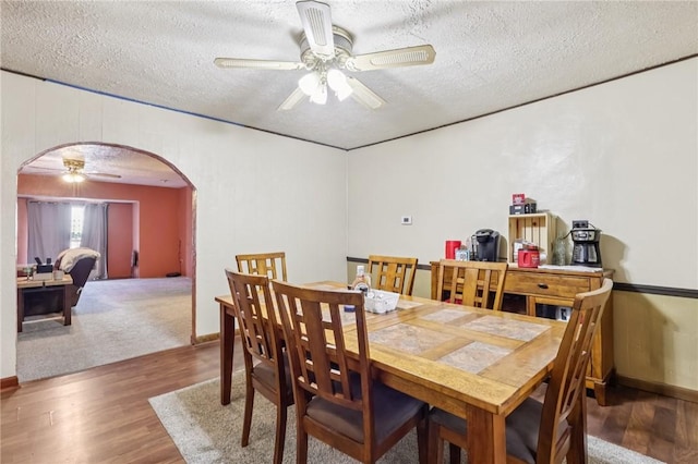 168 Debernardo Ln, Mahoning Twp, PA 16132 - dining area with arched walkways, ceiling fan, a textured ceiling, and wood finished floors
