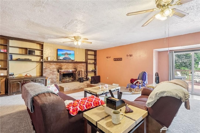 168 Debernardo Ln, Mahoning Twp, PA 16132 - living room with ceiling fan, carpet, a textured ceiling, a brick fireplace, and built in shelves