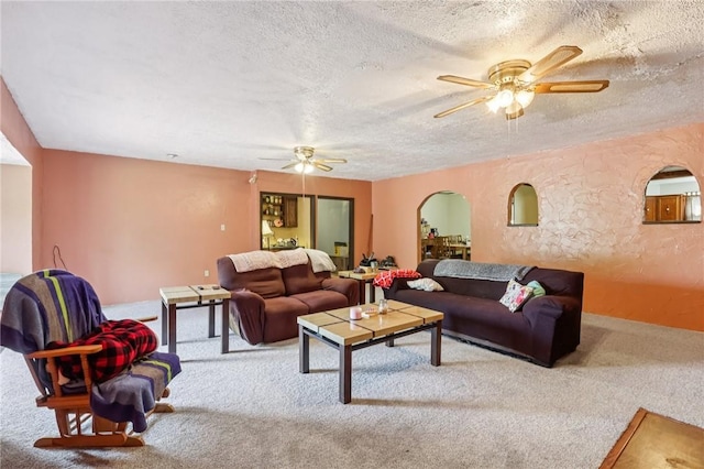 168 Debernardo Ln, Mahoning Twp, PA 16132 - living room with ceiling fan, carpet floors, a textured ceiling, arched walkways, and a textured wall