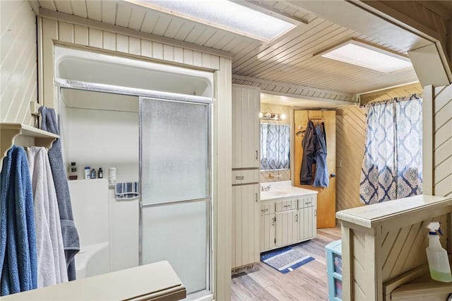 168 Debernardo Ln, Mahoning Twp, PA 16132 - full bath with wood finished floors, a shower stall, vanity, wood walls, and wood ceiling