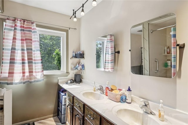 168 Debernardo Ln, Mahoning Twp, PA 16132 - bathroom featuring a shower with curtain, double vanity, and track lighting