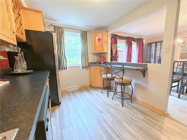 157 Aberdeen Dr, Mccandless, PA 15237 - kitchen with light brown cabinets, dark countertops, light wood-type flooring, and ornamental molding