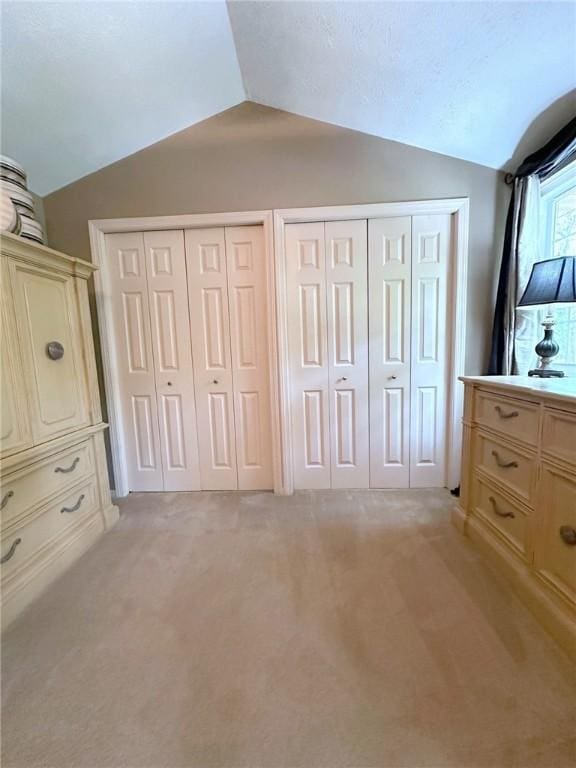 157 Aberdeen Dr, Mccandless, PA 15237 - unfurnished bedroom featuring vaulted ceiling, two closets, and light colored carpet