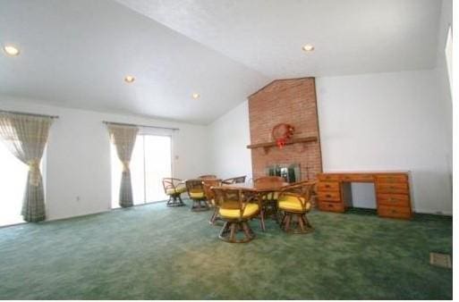 157 Aberdeen Dr, Mccandless, PA 15237 - dining area featuring carpet, vaulted ceiling, a fireplace, and recessed lighting