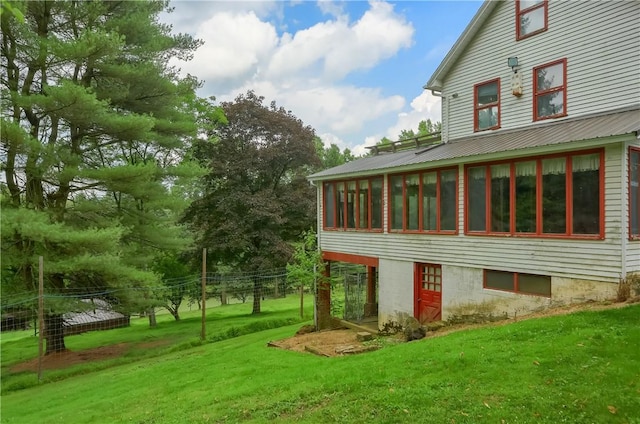 405 Cornetti Rd, Clearfield Twp, PA 16034 - rear view of property featuring a sunroom and a lawn