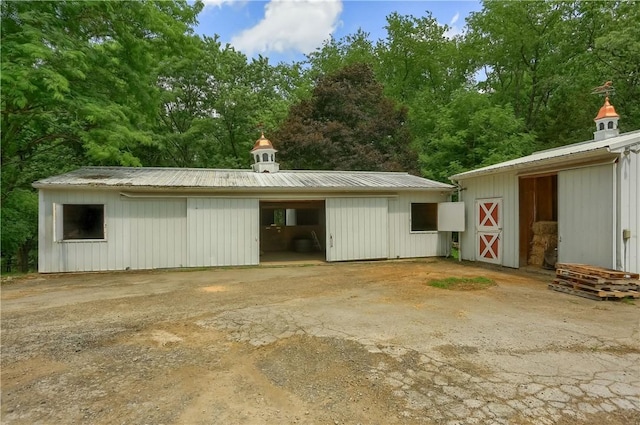 405 Cornetti Rd, Clearfield Twp, PA 16034 - detached garage featuring view of scattered trees
