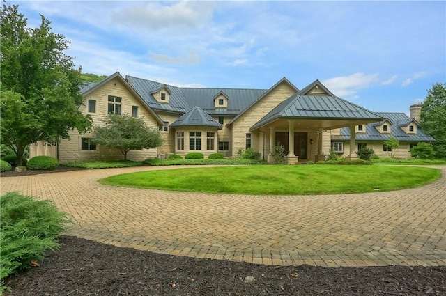 399 Cornetti Rd, Clearfield Twp, PA 16034 - view of front of house featuring a standing seam roof, a metal roof, a front lawn, and a chimney