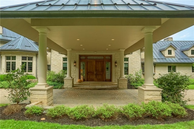 399 Cornetti Rd, Clearfield Twp, PA 16034 - doorway to property with a standing seam roof, a metal roof, and covered porch