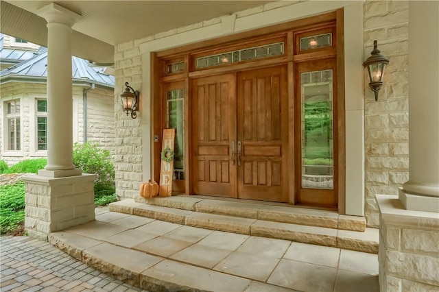399 Cornetti Rd, Clearfield Twp, PA 16034 - entrance to property featuring a porch, stone siding, a standing seam roof, and a metal roof