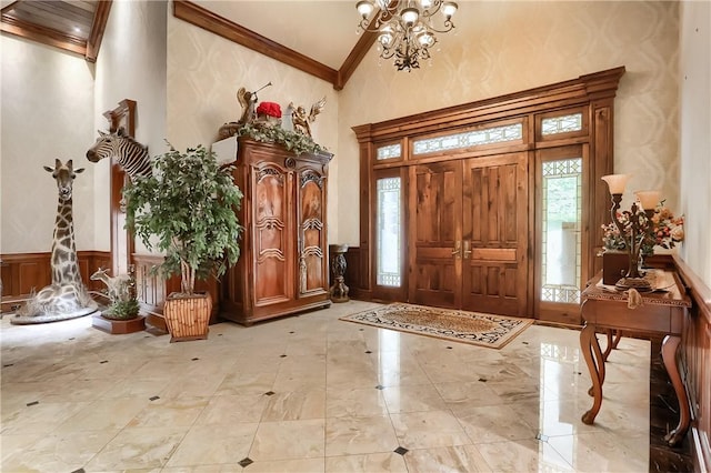 399 Cornetti Rd, Clearfield Twp, PA 16034 - entrance foyer with high vaulted ceiling, crown molding, wainscoting, and a chandelier