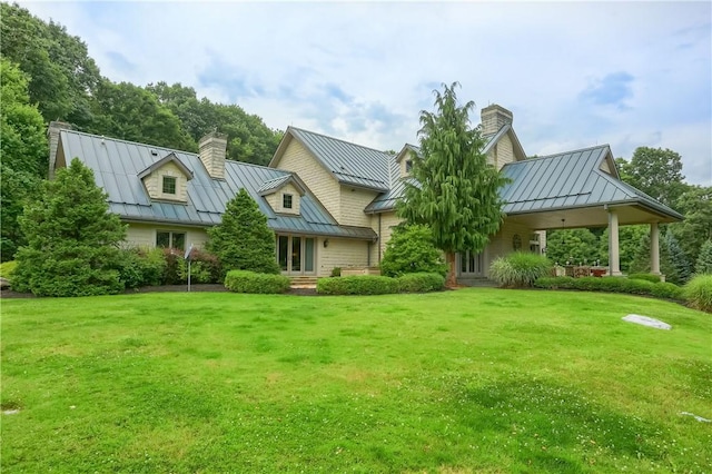 399 Cornetti Rd, Clearfield Twp, PA 16034 - view of front of house featuring a standing seam roof, a chimney, and a metal roof