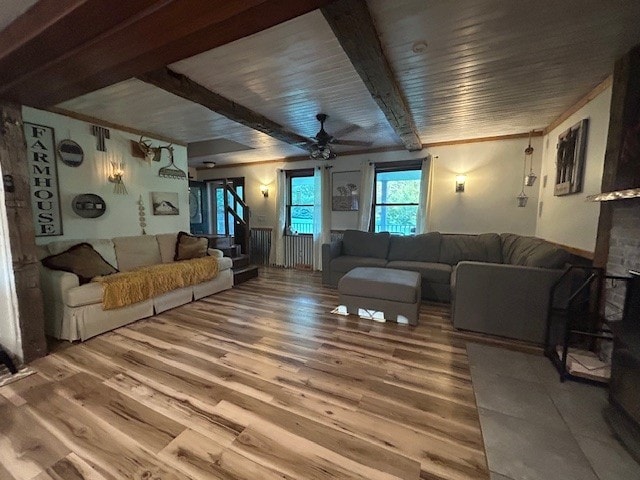 242 Coaltown Rd, Cherry Twp, PA 16020 - living room featuring ceiling fan, beamed ceiling, and light wood finished floors