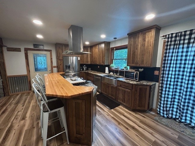 242 Coaltown Rd, Cherry Twp, PA 16020 - kitchen with island range hood, stainless steel appliances, butcher block counters, light wood-type flooring, and recessed lighting