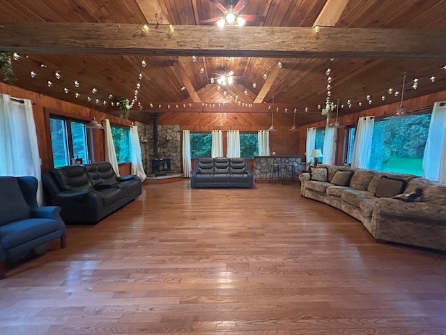 242 Coaltown Rd, Cherry Twp, PA 16020 - living area with a wood ceiling with exposed beams, wood finished floors, high vaulted ceiling, and wooden walls