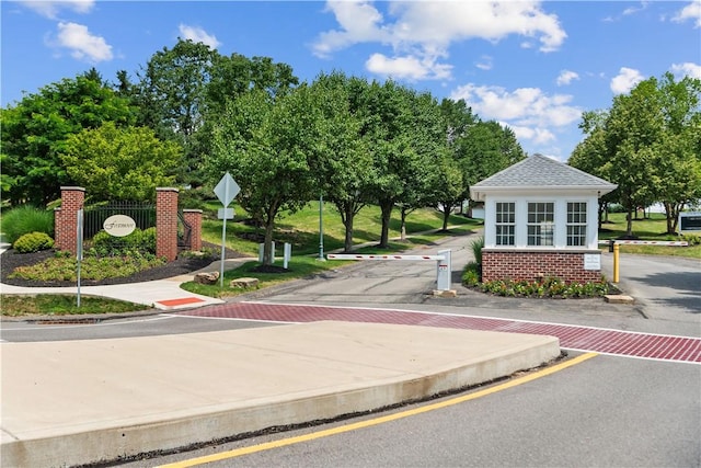 219 Stockton Rdg, Cranberry Twp, PA 16066 - view of asphalt road featuring traffic signs, curbs, and sidewalks