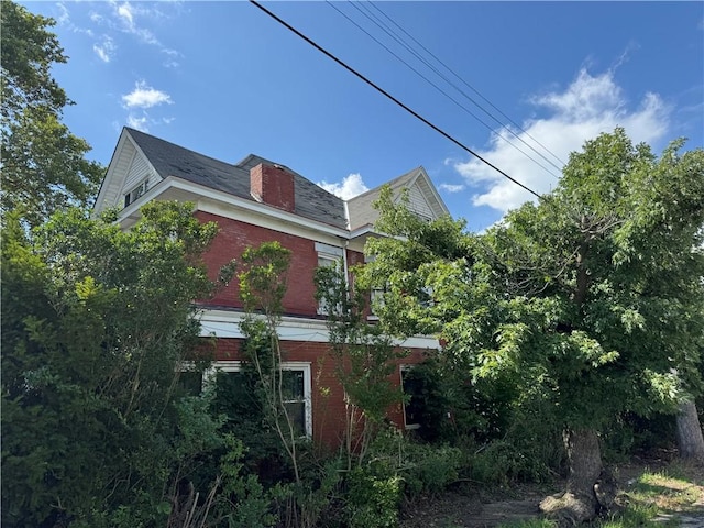 2019 Jenny Lind St, Mckeesport, PA 15132 - view of property exterior featuring brick siding and a chimney