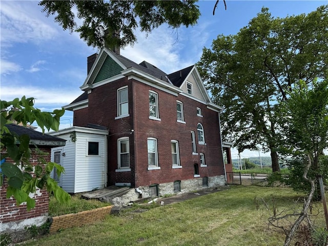 2019 Jenny Lind St, Mckeesport, PA 15132 - view of side of property with a chimney and brick siding